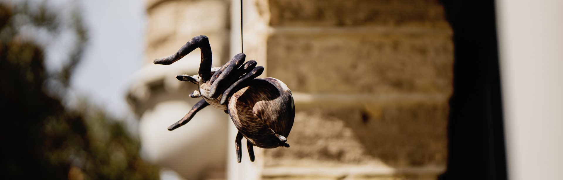 Igor the Spider dangling off the Fire Station balcony