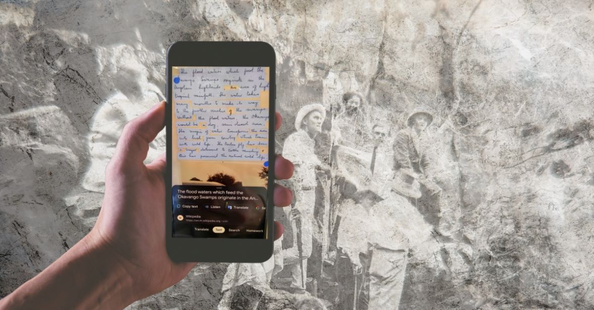 Image of hand with pic in family history background