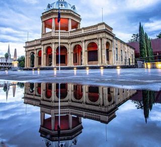 The Bendigo Military Museum reflected in a pool of rain water related image