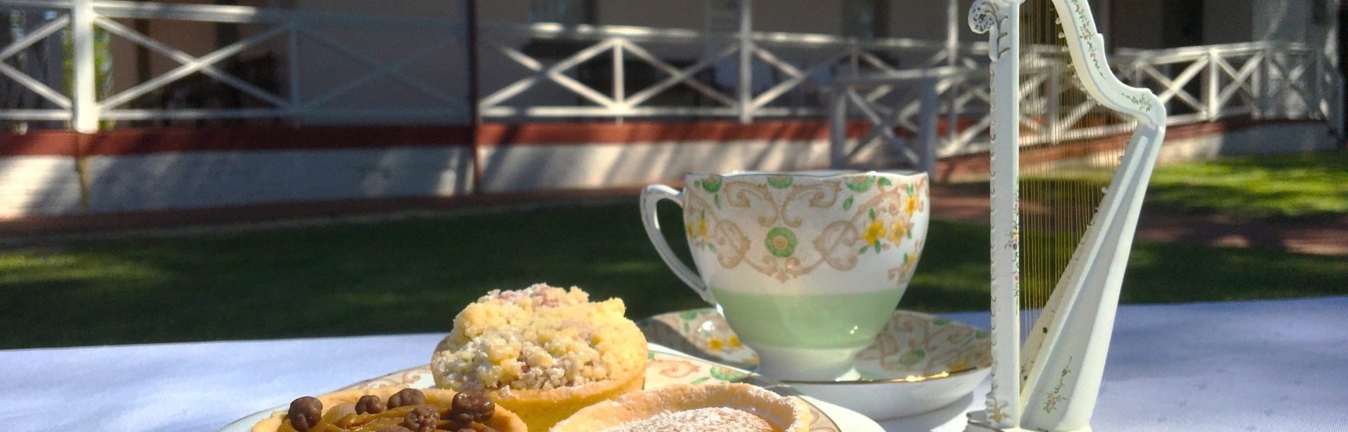 Teacup, tarts and harp in front of the City of Gosnells Museum homestead