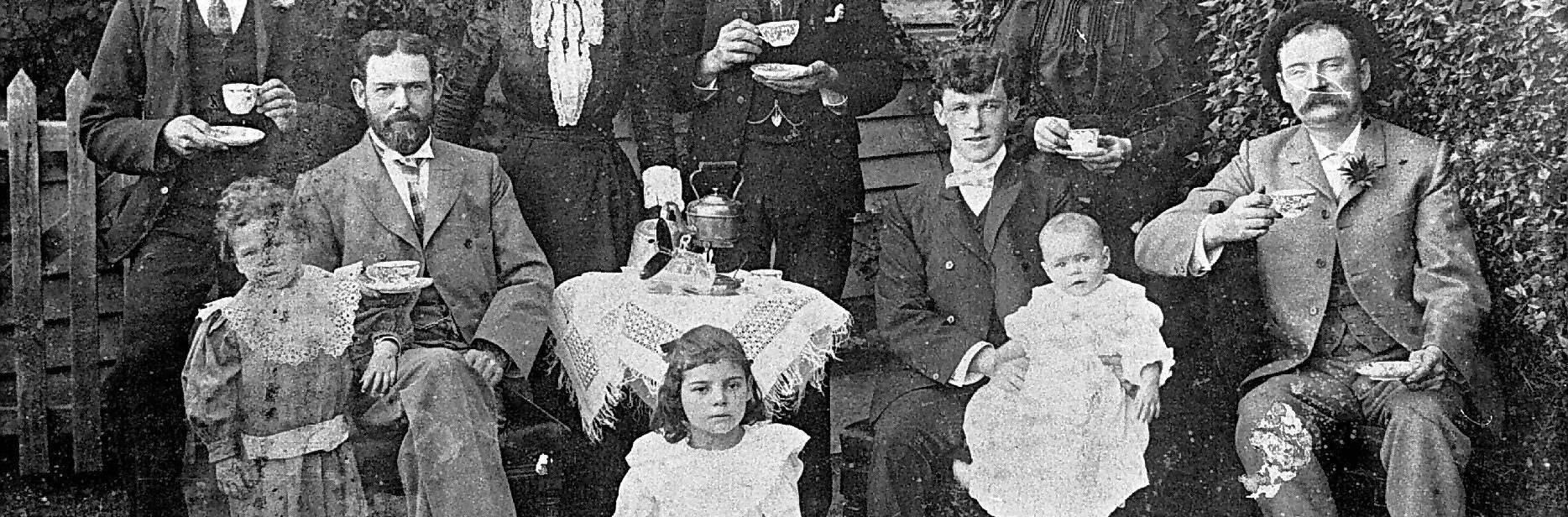 Tea was often served in the garden if the family had one. This photograph shows the Stewart Family at Warracknabeal, c. 1900s. Here, even quite small children have cups, while the table is covered with a fringed ‘tea cloth’ embellished with extensive drawn-thread work. The tea kettle, or large teapot, may be resting on a small primus stove to keep the brew hot.
