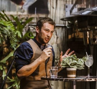 A presenter holding a microphone and telling a story related image