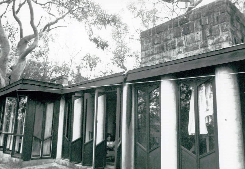 A black and white image of a modern designed building