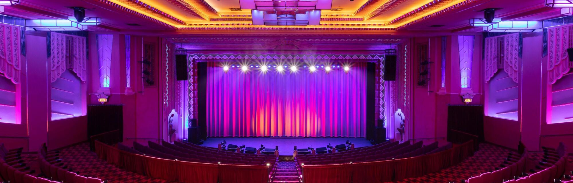 A brightly lit art deco theatre
