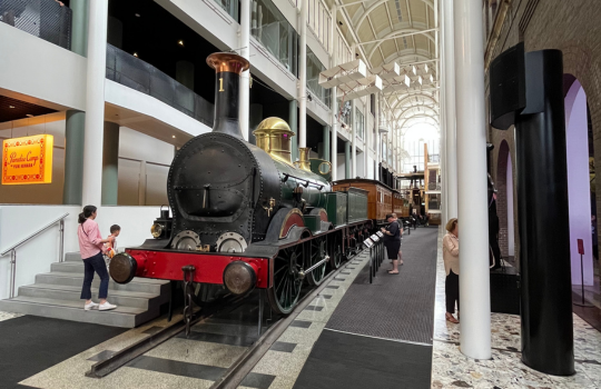 A train on tracks inside a museum